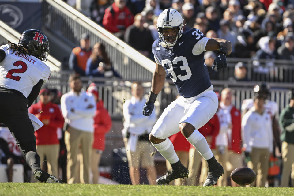 Penn State defensive end Dani Dennis-Sutton (33) looks at fumble by Rutgers quarterback Gavin Wimsatt (2) during the first half of an NCAA college football game, Saturday, Nov. 18, 2023, in State College, Pa. (AP Photo/Barry Reeger)