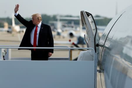 U.S. President Donald Trump boards Air Force One for travel to Naval Station Norfolk from Joint Base Andrews, Maryland, U.S. July 22, 2017. REUTERS/Jonathan Ernst