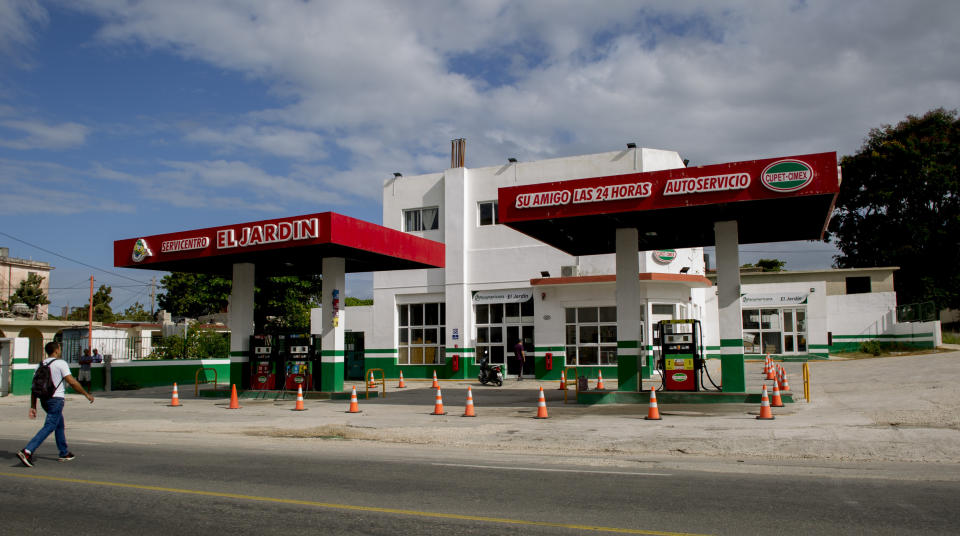 Orange cones mark off gas pumps at a closed station due to the ongoing fuel shortage, in Havana, Cuba, Thursday, Sept. 19, 2019. Cuban officials blame a U.S. policy of sanctioning ships that bring petroleum products from Venezuela, Cuba’s main ally and source of highly subsidized fuel for two decades. Outside observers say the broader cause is Cuba’s energy over dependence on a single socialist ally whose oil industry has gone into freefall. (AP Photo/Ismael Francisco)