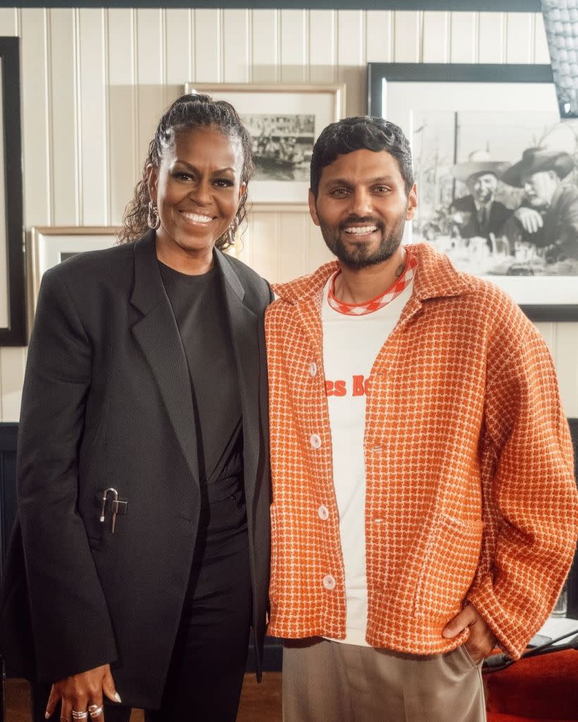 Shetty (seen at right with Michelle Obama) apparently fabricated aspects of his life story. Jay Shetty Podcast