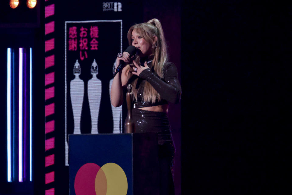 Becky Hill on stage to accept the award for Best Dance Act at the Brit Awards 2023 in London, Saturday, Feb. 11, 2023. (Photo by Vianney Le Caer/Invision/AP)