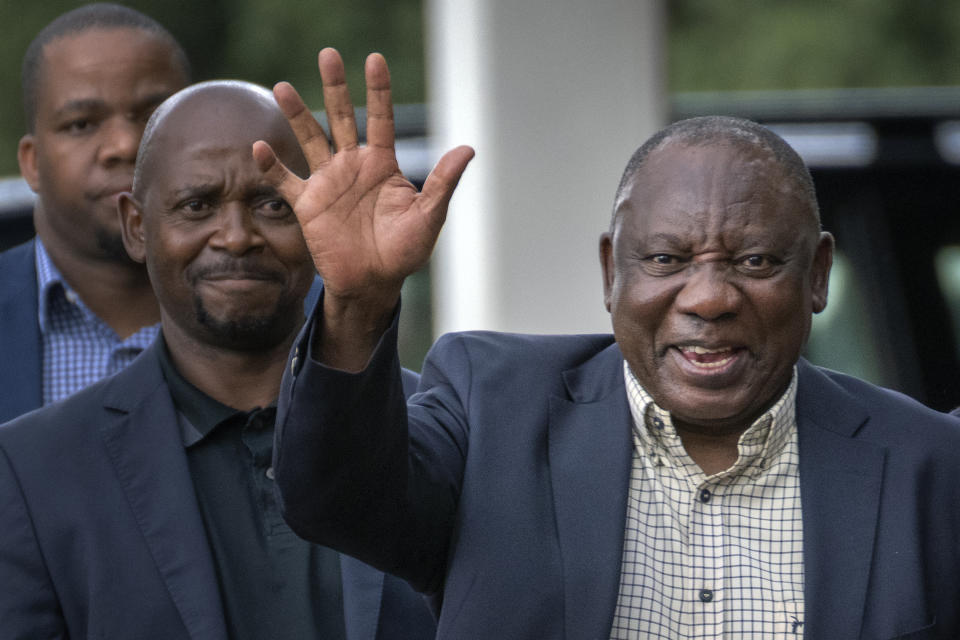 South African President Cyril Ramaphosa leaves an African National Congress (ANC) national executive committee meeting in Johannesburg, South Africa, Monday Dec. 5, 2022. Ramaphosa might lose his job, and his reputation as a corruption fighter, as he faces possible impeachment over claims that he tried to cover up the theft of millions of dollars stashed inside a couch on his farm. (AP Photo/Jerome Delay)