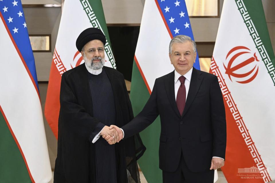 In this photo released by Uzbekistan's President Press Office, Uzbekistan's President Shavkat Mirziyoyev, right, and Iran's President Ebrahim Raisi pose for a photo prior to the Summit of the Economic Cooperation Organization (ECO) in Tashkent, Uzbekistan, on Thursday, Nov. 9, 2023. (Uzbekistan's President Press Office via AP)