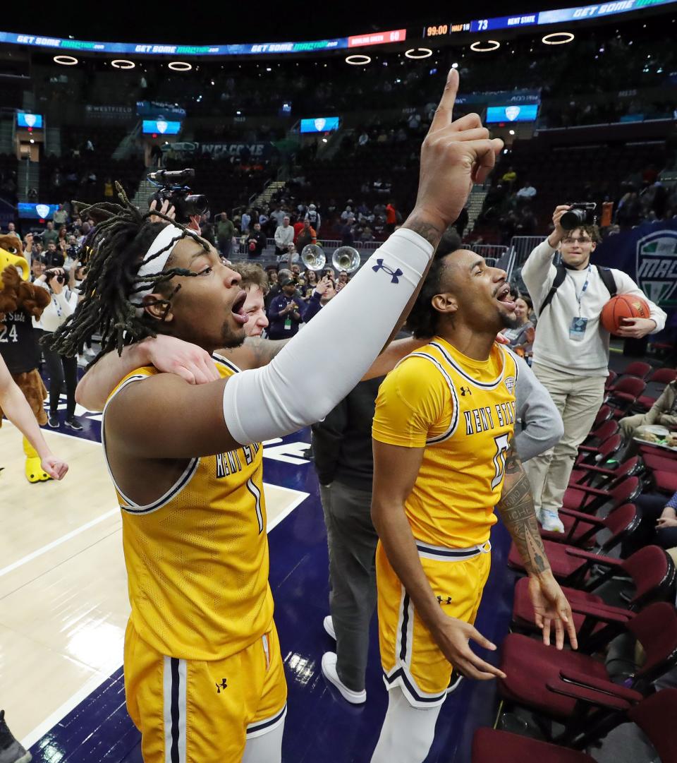 Kent State Golden Flashes forward VonCameron Davis (1) and guard Julius Rollins (0) celebrate after beating the Bowling Green Falcons in an NCAA college basketball game in the semifinals of the Mid-American Conference Tournament at Rocket Mortgage FieldHouse, Friday, March 15, 2024, in Cleveland, Ohio.