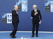 NATO Secretary General Jens Stoltenberg, right, greets Turkey's President Recep Tayyip Erdogan as he arrives for a NATO summit at NATO headquarters in Brussels, Monday, June 14, 2021. U.S. President Joe Biden is taking part in his first NATO summit, where the 30-nation alliance hopes to reaffirm its unity and discuss increasingly tense relations with China and Russia, as the organization pulls its troops out after 18 years in Afghanistan. (Kenzo Tribouillard, Pool via AP)