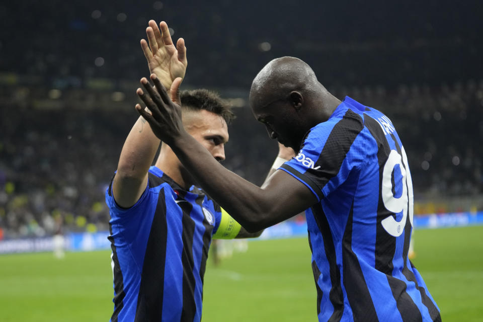 Inter Milan's Lautaro Martinez celebrates with his teammate Romelu Lukaku after scoring his side's opening goal during the Champions League semifinal second leg soccer match between Inter Milan and AC Milan at the San Siro stadium in Milan, Italy, Tuesday, May 16, 2023. (AP Photo/Luca Bruno)