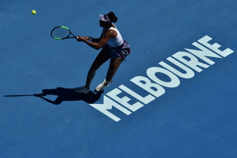 Venus Williams of the US hits a return against Germany's Mona Barthel in their Australian Open fourth round match, in Melbourne, on January 22, 2017