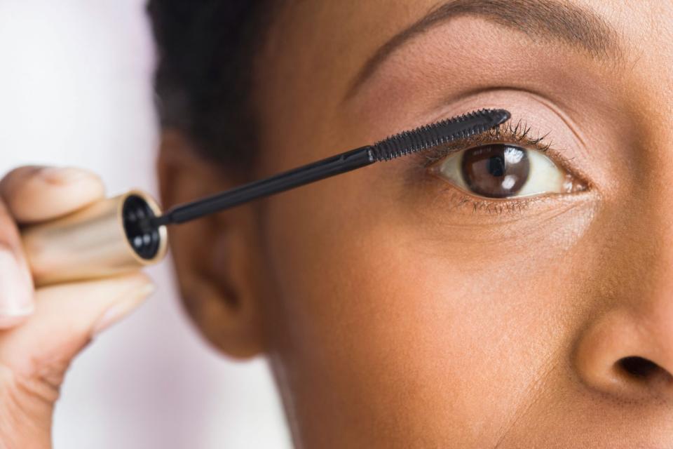 Close Up of Woman Putting On Mascara