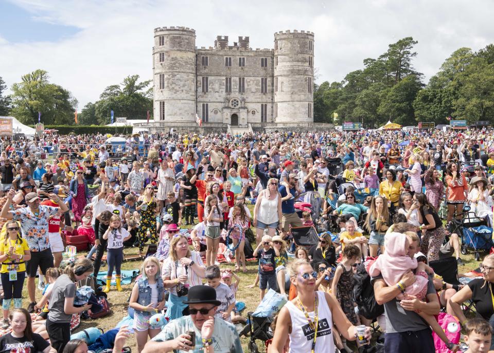 Festival goers watch Mr Tumble in the Castle stage arena at Camp Bestival 2021 at Lulworth Castle - Wareham. Picture date: Saturday 31st July 2021. Photo credit should read: David Jensen/EMPICS Entertainment