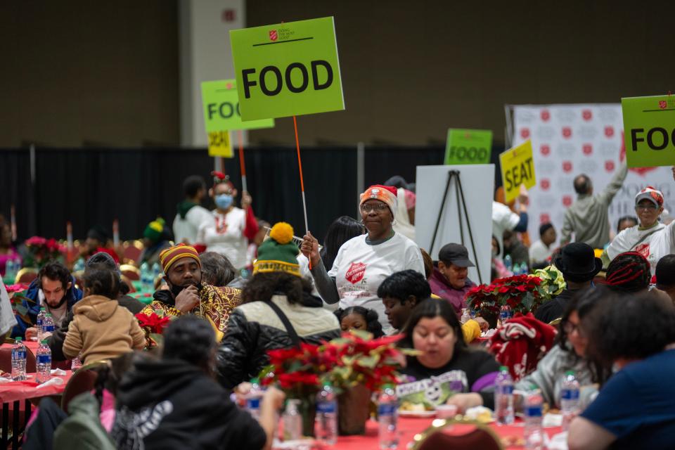 Volunteers help serve guests at the annual Christmas Family Feast Monday, December 25, 2023 at the Wisconsin Center in Milwaukee, Wisconsin. The Salvation Army expected to serve a Christmas dinner to about 4,000 people. Besides meals, guests could get complimentary haircuts, socks, bus passes and gifts. It is the largest feeding event hosted by The Salvation Army on Christmas Day in the country.