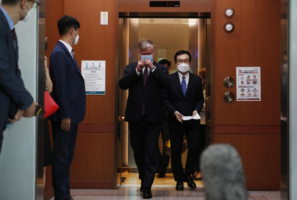 U.S. Deputy Secretary of State Stephen Biegun, center left, walks with his South Korean counterpart Lee Do-hoon, center right, after their meeting at the Foreign Ministry in Seoul Wednesday, July 8, 2020. Biegun is in Seoul to hold talks with South Korean officials about allied cooperation on issues including North Korea. (Kim Hong-ji/Pool Photo via AP)