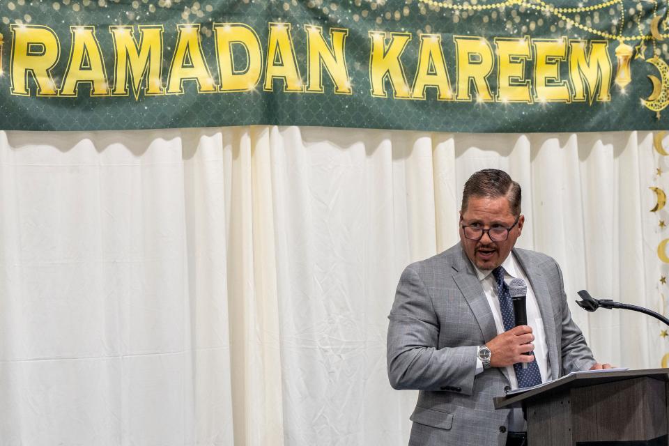 People gather at the Rodda Community Center in Teaneck on Wednesday, March 29, 2023 for a Ramadan community Iftar, to break fast and celebrate together. Teaneck Township Manager Dean Kazinci speaks to the crowd. 