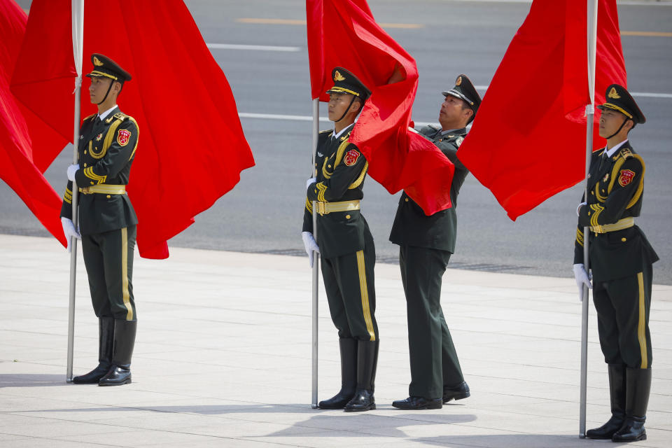 Members of a Chinese honor guard stand in formation before a welcoming ceremony for Russian Prime Minister Mikhail Mishustin in Beijing, China, Wednesday, May 24, 2023. (Thomas Peter/Pool Photo via AP)