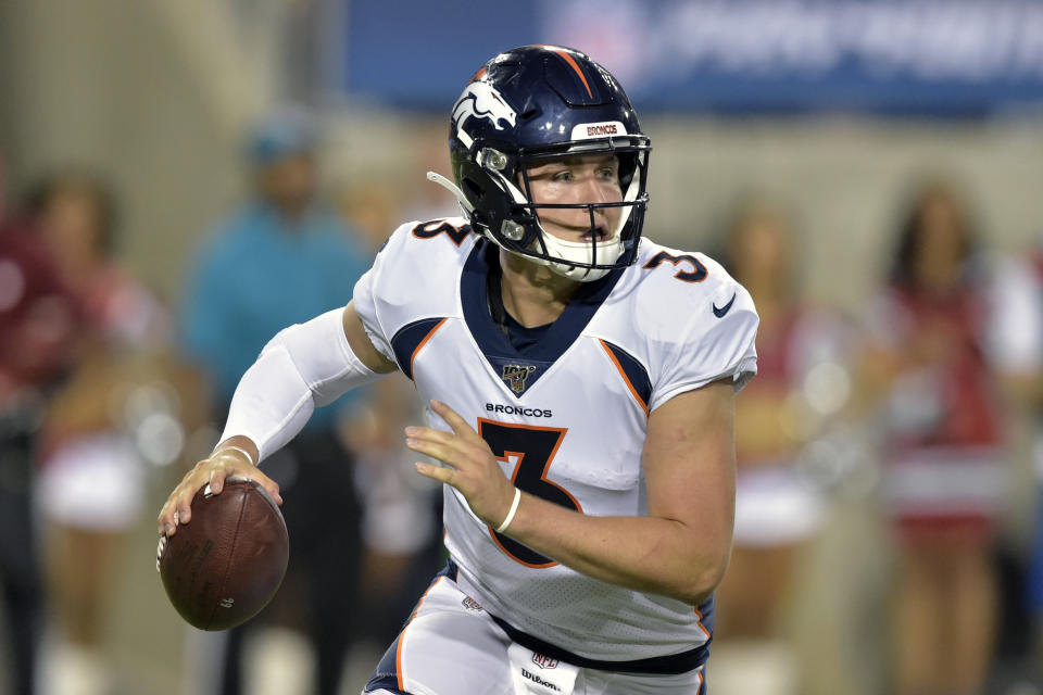 FILE - In this Aug. 1, 2019, file photo, Denver Broncos quarterback Drew Lock scrambles during the second half of the Pro Football Hall of Fame NFL preseason game against the Atlanta Falcons in Canton, Ohio. The Broncos are bringing rookie quarterback Lock back to practice Tuesday, Nov. 12, 2019, to see if he is going to be able to play this season. (AP Photo/David Richard, File)