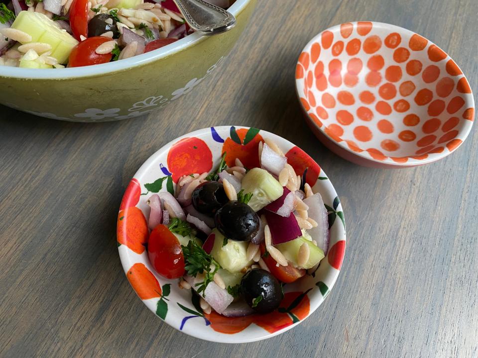 This fresh Orzo Chopped Salad features whole wheat orzo, cucumber, black olives, grape tomatoes, red onion, fresh parsley and a fresh clove garlic.