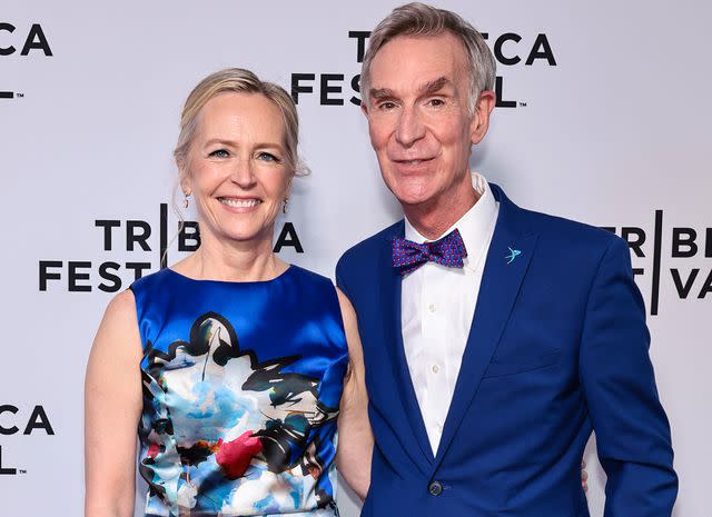 <p>Jamie McCarthy/Getty</p> Liza Mundy and Bill Nye in 2022.