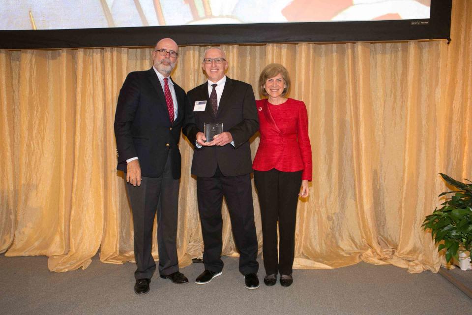 <p>American Red Cross</p> Shaun Brennan (center) received the Presidential Award for Excellence: Biomedical Services from the American Red Cross. He is pictured with Chris Hrouda (left), President of Biomedical Services, and Gail McGovern (right), President & CEO.