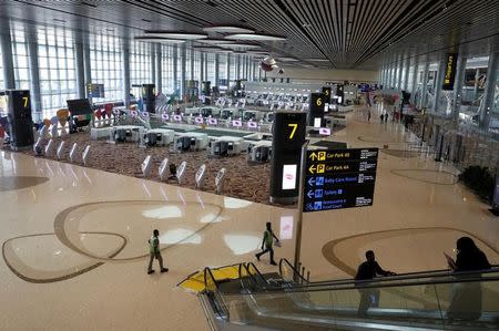 FILE PHOTO: A general view of the check-in area of the departure hall during a media tour of Changi Airport Terminal 4 in Singapore July 25, 2017. REUTERS/Edgar Su -