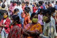 People, belonging to scheduled caste, scheduled tribe and other backward classes stand in queue to claim their rights at a certification camp by the backward classes welfare department in Kolkata, India, Sunday, Nov. 22, 2020. India's total number of coronavirus cases since the pandemic began has crossed 9 million. (AP Photo/Bikas Das)