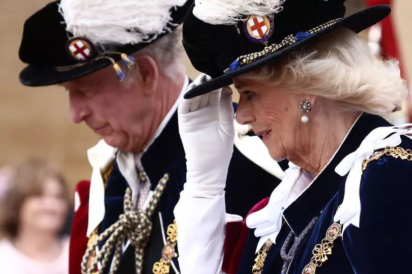 King Charles and Queen Camilla in traditional dress