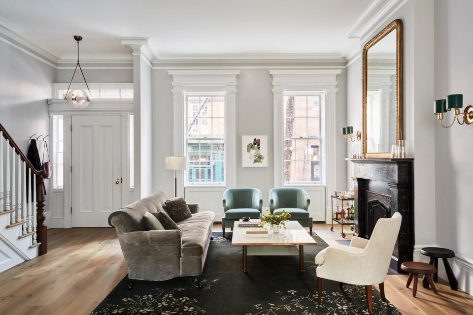 “She loves color, he doesn’t; he loves midcentury, she hates it,” says Kamel of the homeowners’ divided aesthetic loyalties. Her solution: a transitional look that leans heavily on the wife’s traditional preferences. In the living room, custom lounge chairs clad in Pierre Frey fabric mingle with vintage details— Charlotte Perriand Tabouret stools, Josef Frank sconces, a Jacques Adnet drink trolley, and a 19th-century Napoleon gilt mirror—and modern lighting from Apparatus. The rug is by BDDW, the fireplace screen is by Wm. H. Jackson, and the antique floor lamp is from Lief.