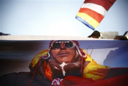 A portrait of Dorjee Khatri, who lost his life in an avalanche at Mount Everest last Friday, is seen on the truck carrying his body during the funeral rally of Nepali Sherpa climbers in Kathmandu April 21, 2014. REUTERS/Navesh Chitrakar