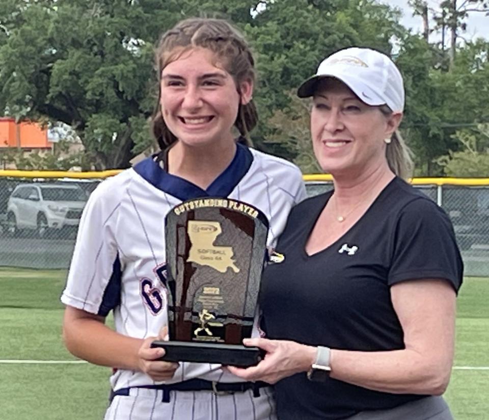 North DeSoto's Ciara Orgeron accepts the LHSAA Class 4A MVP trophy from the LHSAA's Karen Hoyt.