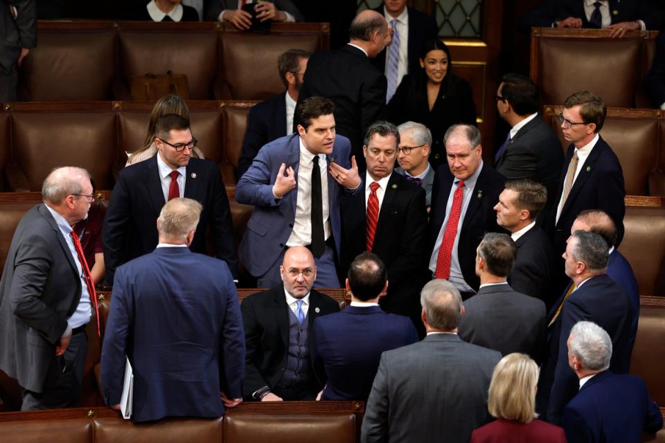 Another dramatic image from the drawn-out bid to elect a Speaker showed Democrat Alexandria Ocasio-Cortez appearing to laugh in the background as Gaetz made an impassioned point to fellow Democrats (Getty Images)