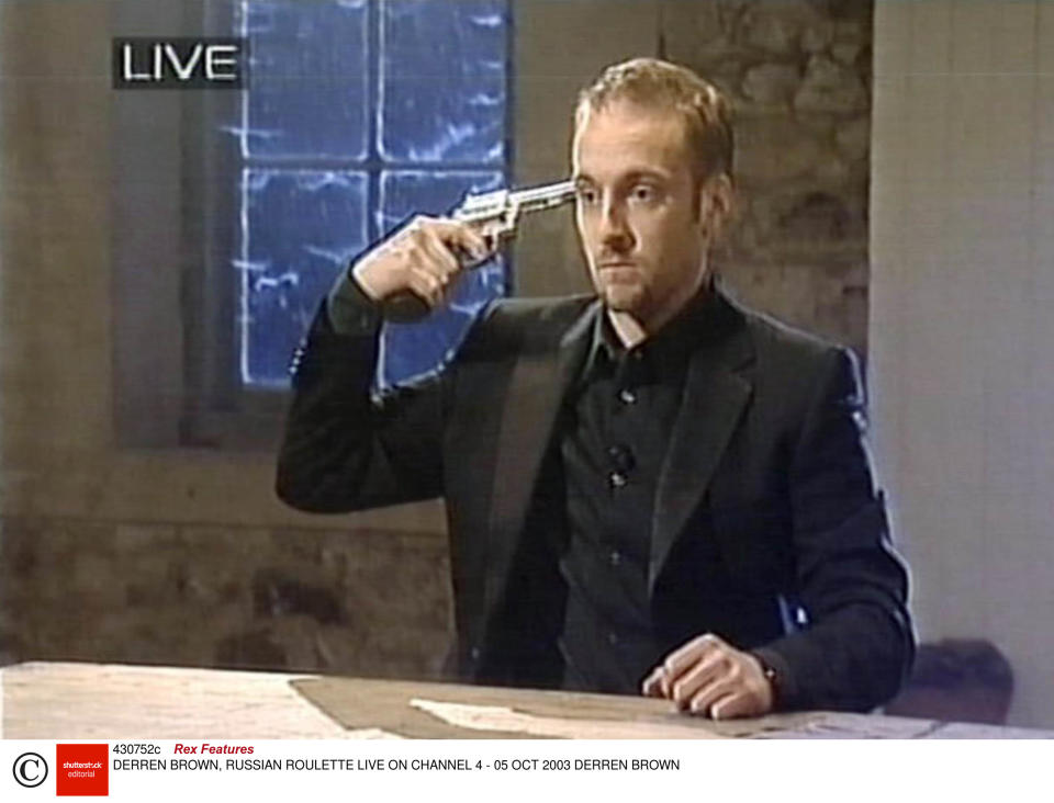 Brown performs a Russian Roulette stunt on live television in 2003Rex