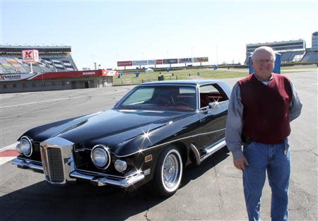 Automobile restorer Walt Hollifield poses with Elvis Presley's 1973 Stutz Blackhawk III during a media event at Charlotte Motor Speedway (CMS) in Charlotte, North Carolina April 1, 2014, in this handout courtesy of CMS. REUTERS/CMS/HHP/Handout via Reuters