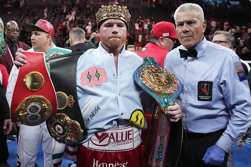 Canelo Alvarez celebrates after defeating Gennady Golovkin in their super middleweight title boxing match on Saturday.