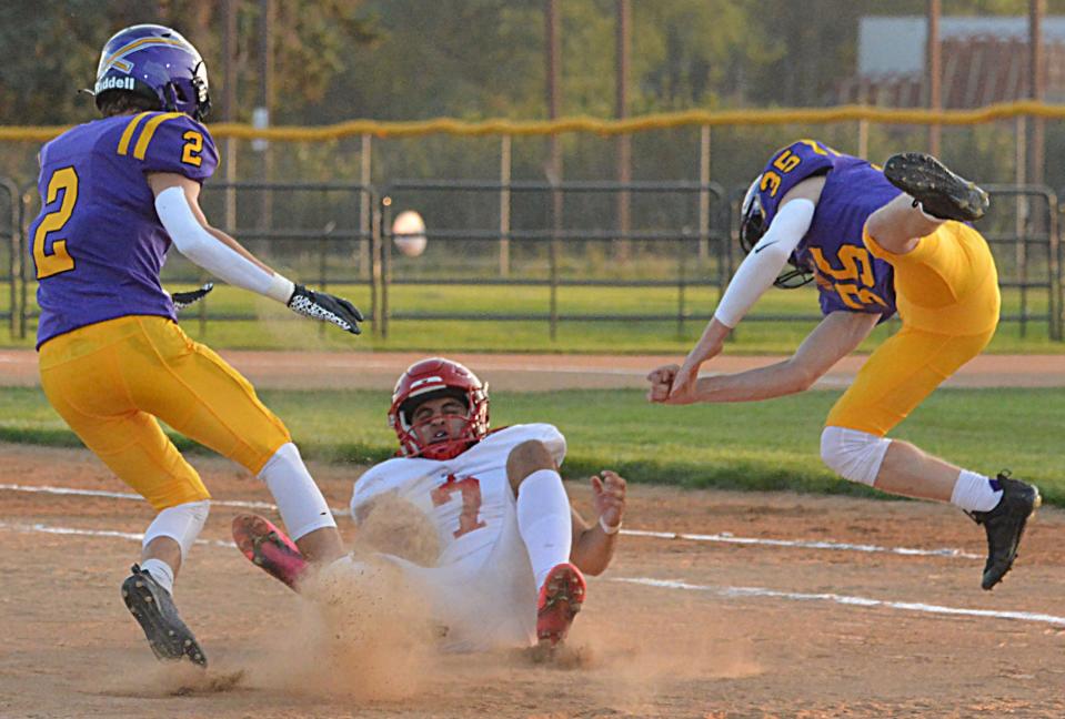 Watertown's Owen Spartz (35) takes down Yankton's punter Josue Trujillo-Melgoza after the snap sailed over his head during their Eastern South Dakota Conference football game on Friday, Sept. 8, 2023 at Watertown Stadium. Also charging is Watertown's Peyton Buisker (2).