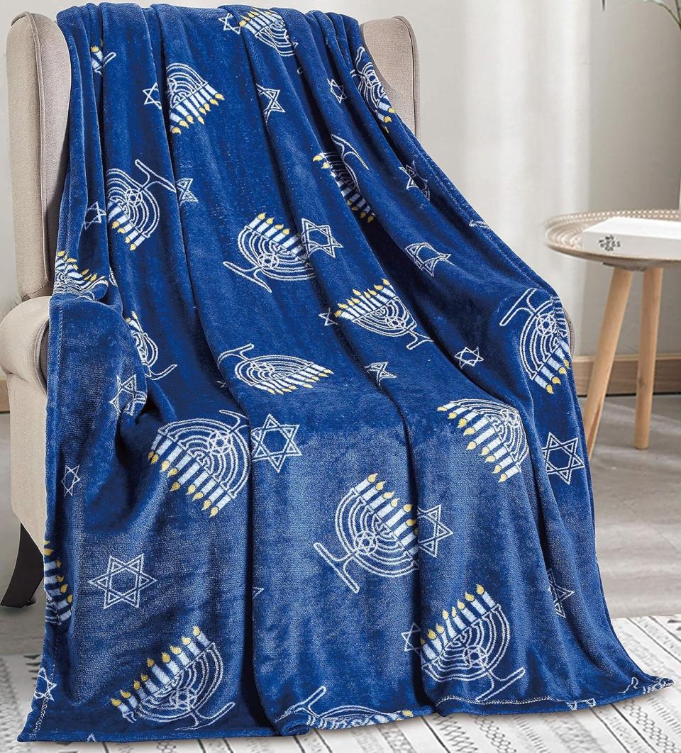 blue blanket with menorah and star of david pattern on chair