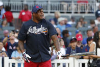Former Atlanta Braves center fielder Andrew Jones steps to the plate as he competes in the Braves Alumni softball home run derby before a baseball game against the Los Angeles Dodgers, Saturday, Aug. 17, 2019, in Atlanta. (AP Photo/John Bazemore)