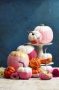 <p>We spotted this <a href="http://www.papernstitchblog.com/2015/10/12/easiest-no-carve-pumpkin-idea-balloon-dipped-pumpkins-diy/" rel="nofollow noopener" target="_blank" data-ylk="slk:"dipped"-looking pumpkin DIY;elm:context_link;itc:0;sec:content-canvas" class="link ">"dipped"-looking pumpkin DIY</a> on Brittni Mehlhoff's blog, <a href="http://www.papernstitchblog.com/" rel="nofollow noopener" target="_blank" data-ylk="slk:Paper & Stitch;elm:context_link;itc:0;sec:content-canvas" class="link ">Paper & Stitch</a>, and put it on our cover. For a pop of color, snip the ends off opaque balloons (11 inches for mini pumpkins, larger for the big guys) and stretch around the bases. </p><p><a class="link " href="https://www.amazon.com/Balloons-Assorted-Birthday-Decoration-Accessory/dp/B07MKWX51X/?tag=syn-yahoo-20&ascsubtag=%5Bartid%7C10055.g.1714%5Bsrc%7Cyahoo-us" rel="nofollow noopener" target="_blank" data-ylk="slk:SHOP BALLOONS;elm:context_link;itc:0;sec:content-canvas">SHOP BALLOONS</a><br></p>