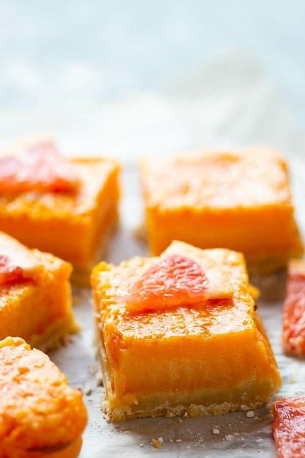 Grapefruit bars on parchment paper.