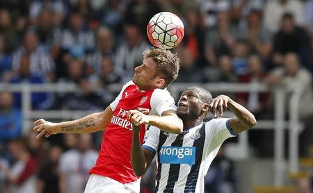 Football - Newcastle United v Arsenal - Barclays Premier League - St James' Park - 29/8/15 Arsenal's Olivier Giroud in action with Newcastle's Georginio Wijnaldum Reuters / Andrew Yates Livepic