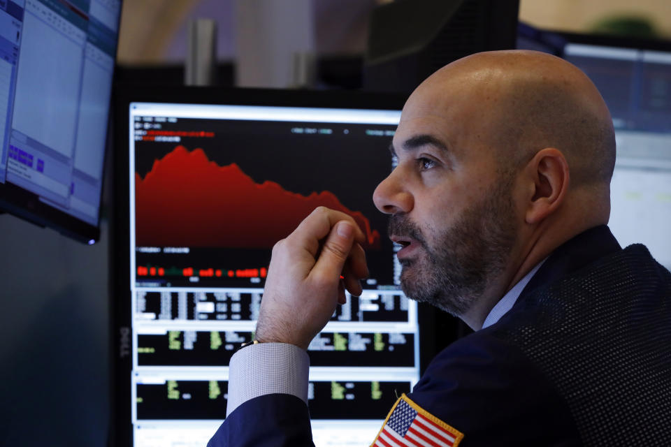 Trader Fred DeMarco works on the floor of the New York Stock Exchange, Friday, Feb. 28, 2020. Global stock markets are falling further on spreading virus fears. (AP Photo/Richard Drew)