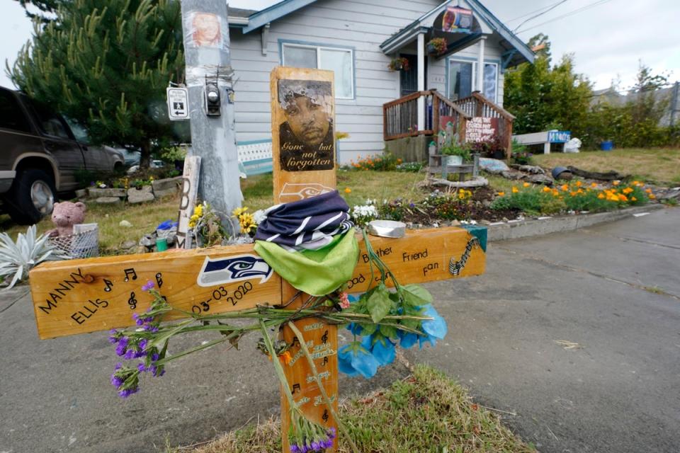 A sign that reads “Gone but not forgotten” is shown on a cross displayed May 27, 2021, at a memorial (Copyright 2021 The Associated Press. All rights reserved.)