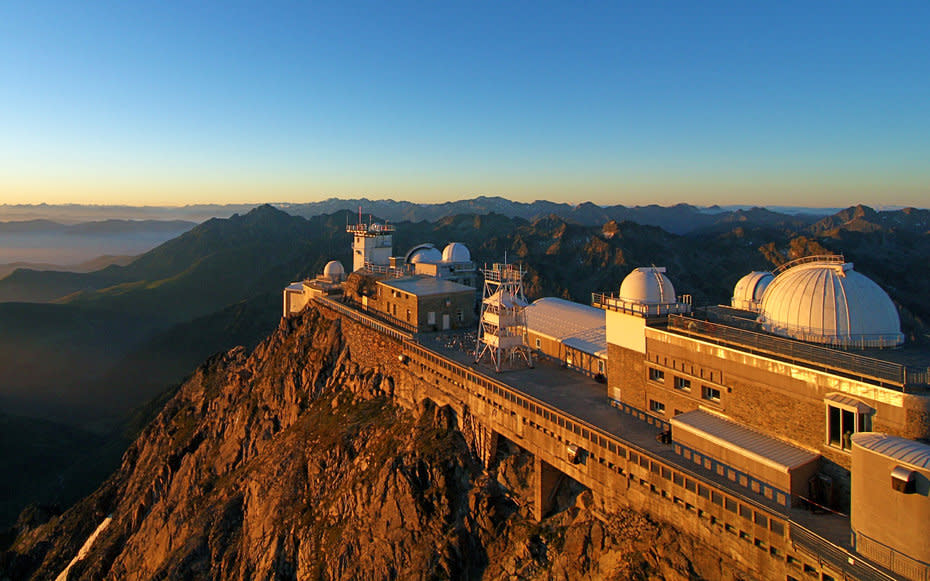 <p><em>Pic du Midi, Hautes-Pyrnes, France</em></p> <p>In the early 1960s, one of the biggest questions of all for NASA was where on the Moon to land, so they set about mapping as much of the satellite's surface as possible in search of a juicy crater or two.</p> <p>Perched atop a mountain in the French Pyrenees, the <a rel="nofollow noopener" href="http://mashable.com/2015/12/14/stormtrooper-france/" target="_blank" data-ylk="slk:Pic du Midi;elm:context_link;itc:0;sec:content-canvas" class="link ">Pic du Midi</a> observatory at 9,439 feet up was fitted with a 42-inch telescope in 1963, paid for by NASA, to take photographs of the Moon. It's a fabulous place to visit; its Nuit au sommet package consists of dinner, unbeatable stargazing and a night in the scientists' quarters.</p>