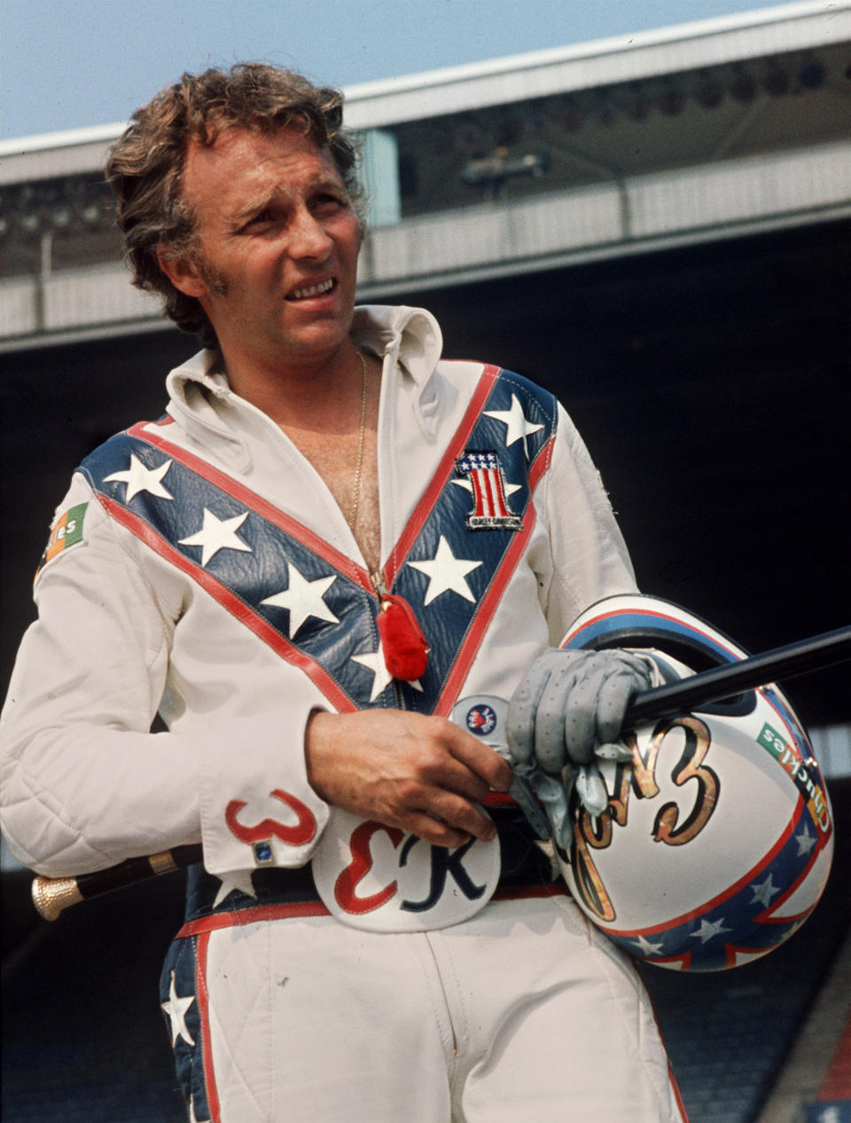 FILE - In this Aug. 20, 1974 file photo Daredevil motorcyclist Evel Knievel poses at the open-air Canadian national exhibition stadium in Toronto. A judge has dismissed a trademark infringement lawsuit filed by Evel Knievel’s son against the Walt Disney Co. and movie company Pixar over a “Toy Story 4” daredevil character named Duke Caboom. Kelly Knievel said Monday, Sept. 27, 2021, he's disappointed and may take the case to the 9th Circuit Court of Appeals in San Francisco. (AP Photo/Chris O'Meara, File)