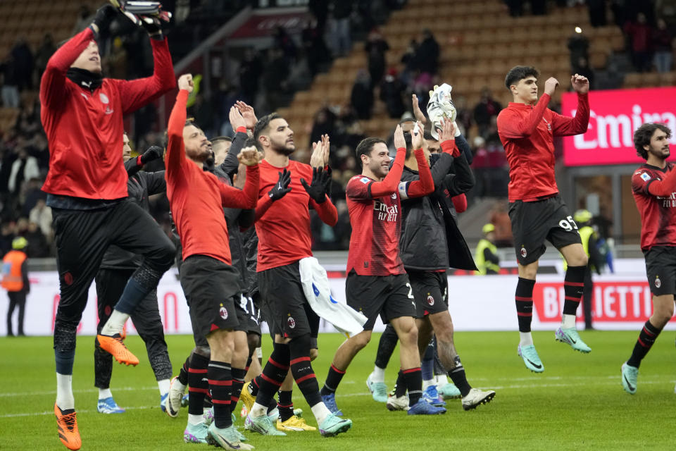 Milan players celebrate at the end of the Serie A soccer match between AC Milan and Frosinone at the San Siro stadium, in Milan, Italy, Saturday, Dec. 2, 2023. Milan won 3-1. (AP Photo/Luca Bruno)