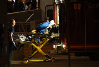 <p>A witness is loaded into an ambulance, after she and others were taken to Thornton Civic Center, preceding a shooting inside the Walmart Super Center, Nov. 1, 2017 in Thornton, Colo. (Photo: RJ Sangosti/The Denver Post via Getty Images) </p>