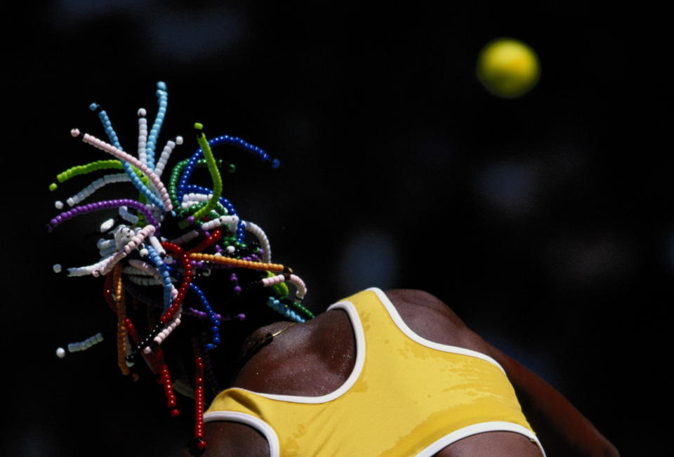 Williams playing at the Australian Open in 1999 with her signature beaded braids.<p>Photo: Clive Brunskill/Getty Images</p>