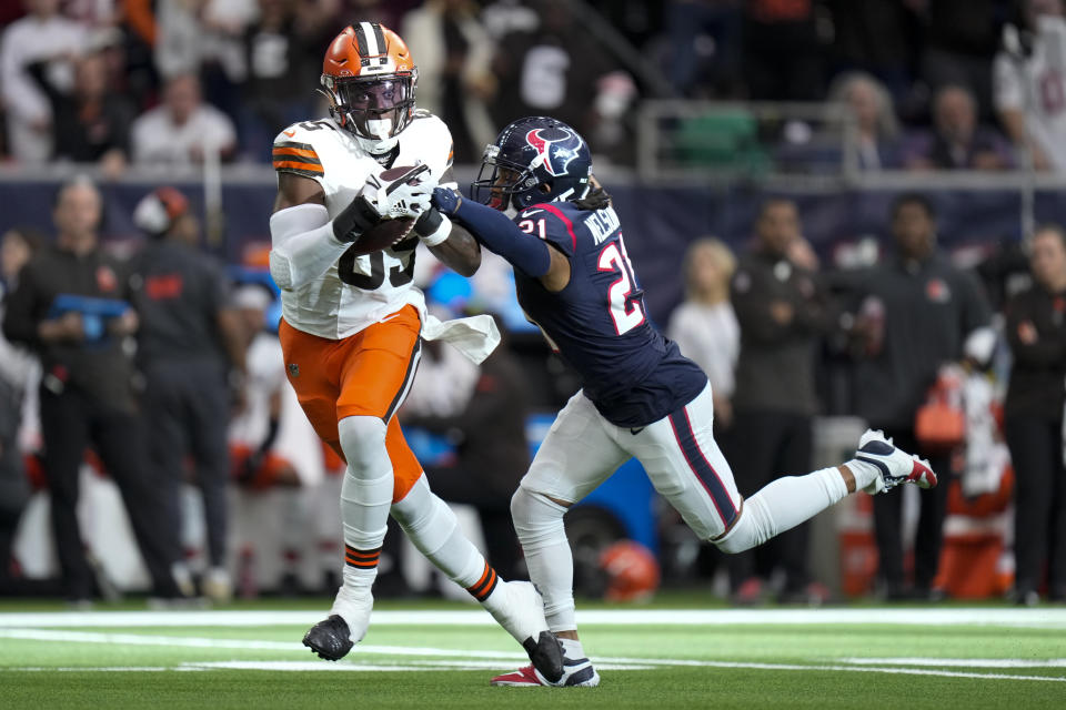 Cleveland Browns tight end David Njoku is tackled by Houston Texans cornerback Steven Nelson during the first half of an NFL wild-card playoff football game Saturday, Jan. 13, 2024, in Houston.(AP Photo/Eric Christian Smith)