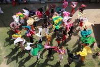 <p>Students of Gargi College dance in their dupattas and bangles for the upcoming festival of Diwali in New Delhi, India. ( Amal KS/Hindustan Times via Getty Images) </p>