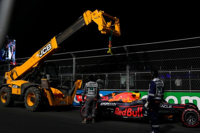 Max Verstappen's Red Bull is towed away