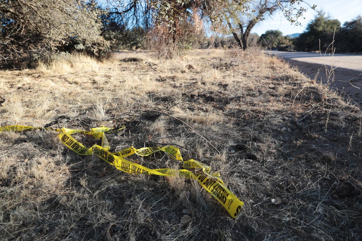 Police tape remains at one of two areas where 19 human limbs were found in a remote forest area outside of Prescott on Dec. 26, 2020. Walter Mitchell, 59, who had recently closed a business in Seattle that held cadavers for research, was arrested on Dec. 29, 2020, and accused of dumping human body parts at these locations.