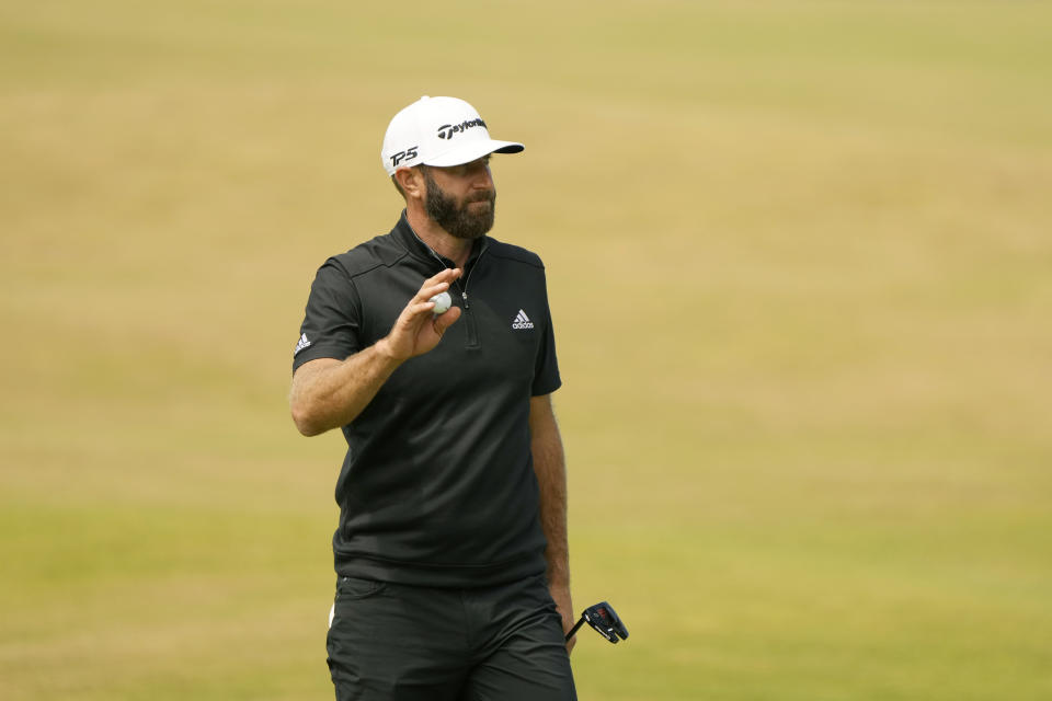 Dustin Johnson of the US after putting on the 18th green during the second round of the British Open golf championship on the Old Course at St. Andrews, Scotland, Friday July 15, 2022. The Open Championship returns to the home of golf on July 14-17, 2022, to celebrate the 150th edition of the sport's oldest championship, which dates to 1860 and was first played at St. Andrews in 1873. (AP Photo/Gerald Herbert)