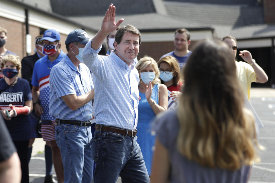 Former U.S. Ambassador to Japan Bill Hagerty waves to supporters at a polling place Thursday, Aug. 6, 2020, in Brentwood, Tenn. Hagerty and Dr. Manny Sethi are competing to become the GOP nominee in the race to replace retiring Republican Sen. Lamar Alexander. (AP Photo/Mark Humphrey)